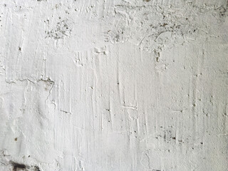 Textured white concrete wall with visible imperfections and subtle variations in surface © Roman
