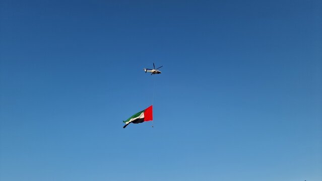 Helicopter Carrying UAE Flag Above Sheikh Zayed Grand Mosque Abu Dhabi