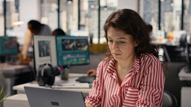 Woman staff working on laptop in smart office corporation at desk