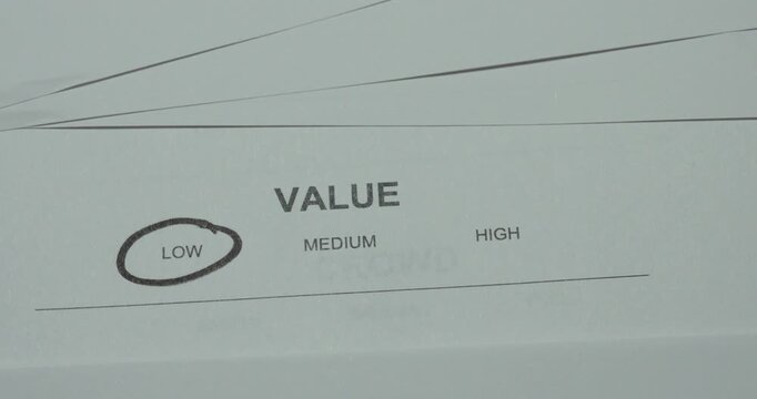 Low value circled on a printed evaluation form, representing valuation, comparison and prioritization