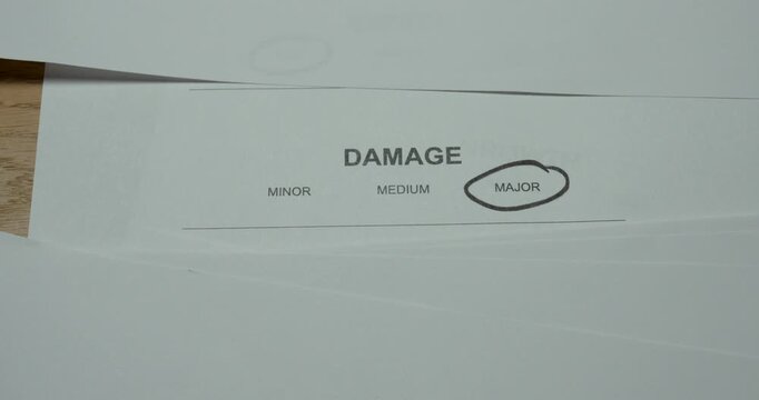 Major damage circled on a printed assessment form, representing severe damage classification and inspection documentation