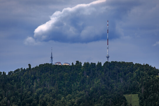 Uetliberg mountain television tower under dramatic clouds in Zurich, Switzerland