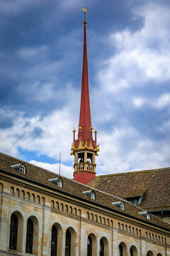 Red timber belfry turret spire of the Grossmunster church in Zurich, Switzerland