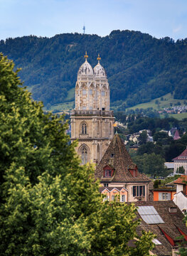 Grossmunster towers above tiled roofs in Altstadt old town Zurich, Switzerland
