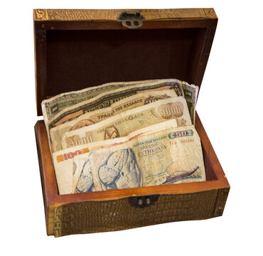 Ancient Greek drachmas in a small wooden box