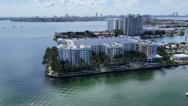 Aerial Drone Orbit Over Miami Bayfront Apartments with Marina and Skyline, HD
