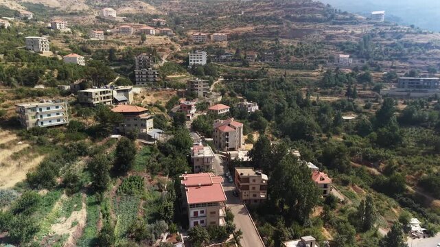 Aerial Drone View of Mountain Village and Green Valley in Hasroun,  Lebanon
