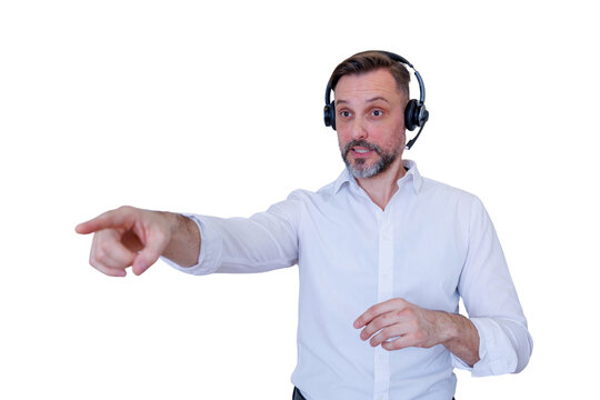 Confident man in a headset pointing, communicating instructions or presenting information, offering expert support and interaction