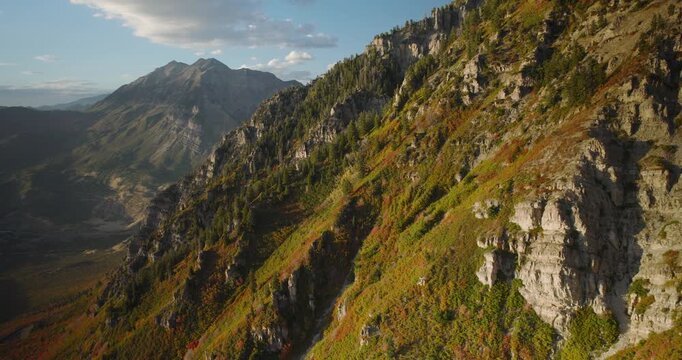 Majestic Autumn Colors On Beautiful Utah Rocky Mountain Side With View Of Gorgeous Valley - Drone Shot