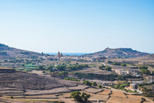 Ghasri landscape and fields with the Parish Church of Christ the Eucharistic Savior on the horizon, Gozo MALTA