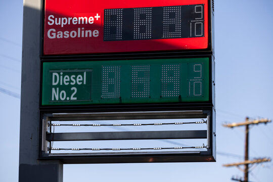 A Gas Station price board displays extremely high gasoline and diesel prices.
