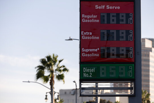 A Gas Station price board displays extremely high gasoline and diesel prices.