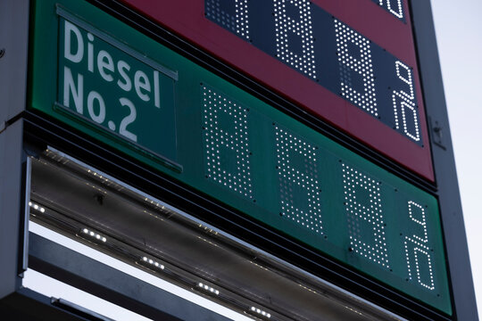 A Gas Station price board displays extremely high gasoline and diesel prices.