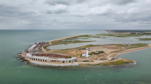 Hurst Point Lighthouse and Hurst Castle from drone over Hurst Spit, Milford on Sea, Lymington, Hampshire, England, United Kingdom