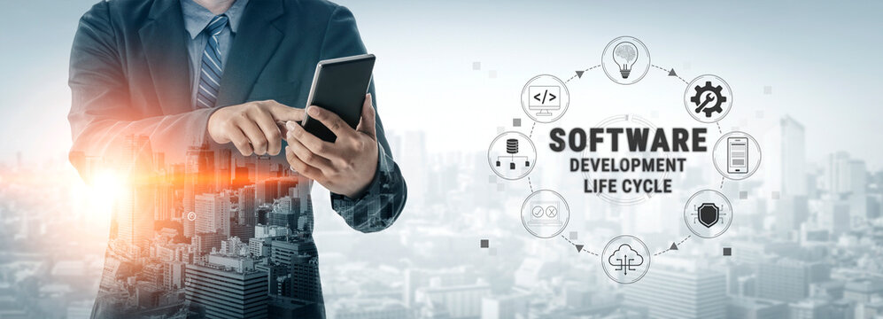 Professional Businessman Engaging with Mobile Technology in Software Development Life Cycle Over a Modern Cityscape Background Quark.