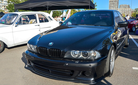 Iconic black BMW M5 (E39) performance sedan with blacked out grilles and M wheels, legendary as the gold standard of high performance V8 executive saloons
