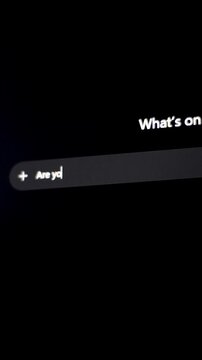 Computer screen showing text input field with user typing question for AI chatbot asking it if artificial intelligence is going to kill humanity, fearing human extinction by a super intelligence