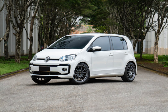 White Volkswagen Up TSI Hatchback Front Three Quarter View Outdoor Road
