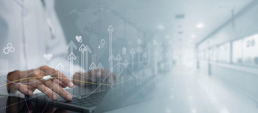 Healthcare technology concept showing digital data analytics, business growth and medical innovation with professional using laptop in modern hospital environment for connected services