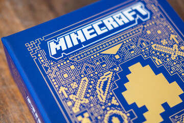 Naklejka premium Minecraft books covers pixel art design, Mojang official merchandise guide books, Collector items for Minecraft fans, Pop culture, gaming literature collector items blocky aesthetic, gaming franchise