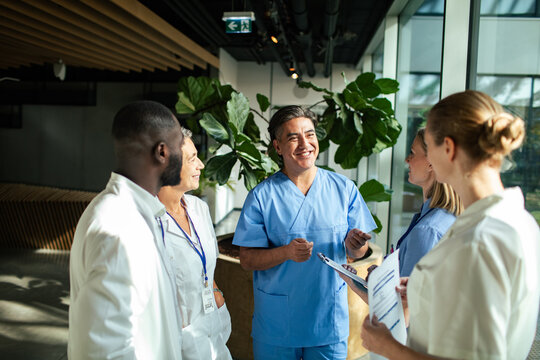 Medical team huddles during hospital briefing
