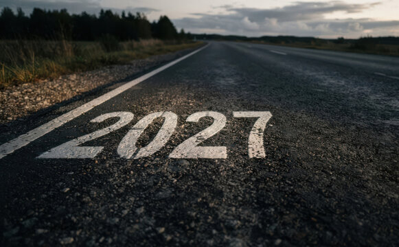 Road ahead painted with the year 2027 representing future planning, goals, and upcoming milestones in business and life