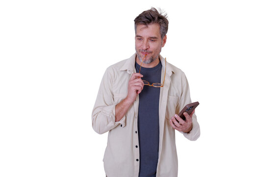Man holding smartphone and glasses, looking away while pondering, reflecting, and making decisions. Transparent background