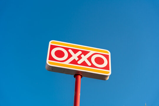 Oxxo advertising billboard, by Mexico's Femsa, in store parking lot. Jalisco, Mexico, July 20, 2026. FEMSA