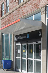 Obraz premium exterior building facade and sign of Mount Pleasant Station on Line 5 Eglinton located in midtown Toronto at the intersection of Eglinton Avenue East and Mount Pleasant Road