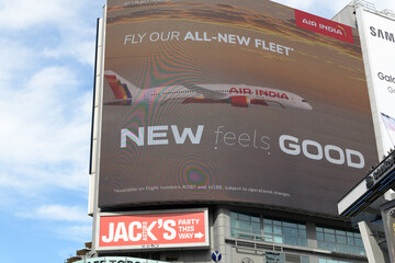Obraz premium large-format electronic billboard featuring ad for Air India outside The Tenor a shopping mall facing Sankofa Square, Toronto
