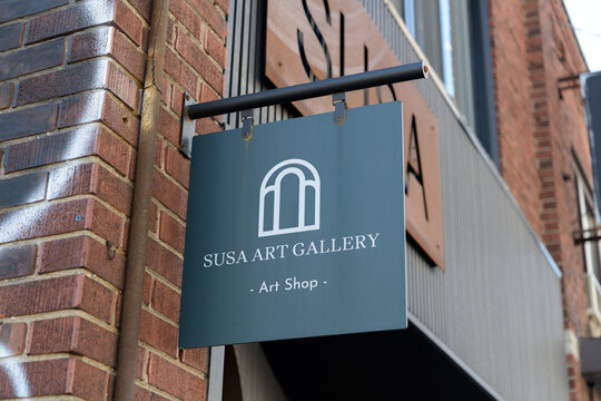 wall mounted projecting sign outside Susa Art Gallery located at 711 Mount Pleasant Rd, Toronto