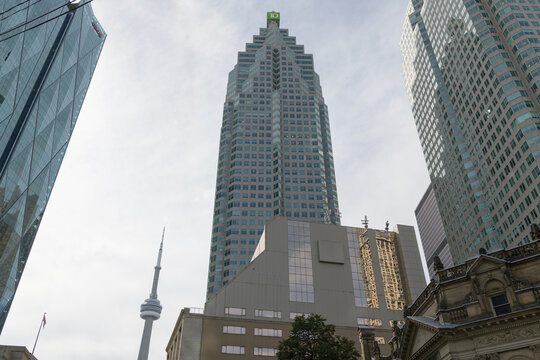 an upward view of TD Place (161 Bay St) with nearby buildings, Toronto