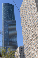 Obraz premium (at right) old apartment and (at left) east elevation of Aura, a mixed-use skyscraper completed in 2014, designed by Graziani + Corazza, located at 386 & 388 Yonge Street (at Gerrard Street), Toronto
