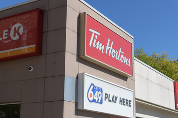 Obraz premium close-up of a Tim Hortons / Lotto 649 sign at 381 Mount Pleasant Rd (inside Esso gas station complex), Toronto