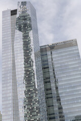 Fototapeta premium abstract reflection of landmark tower on the mirrored glass windows, west elevation of Delta hotel, 75 Lower Simcoe and Marsh/McLennan office tower in the Southcore Financial area, Toronto