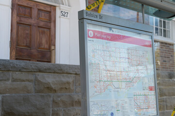 Fototapeta premium busted public transit shelter with TTC system map at Belsize Dr outside 527 Mount Pleasant Rd, Toronto (Mount Pleasant Baptist Church)