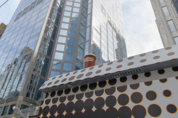 Fototapeta premium Tim Hortons coffee cup on a painted traffic control box in downtown Toronto