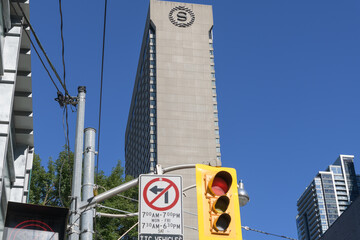 Fototapeta premium an upward view of logo-sign on the side of the Sheraton, a 4-star hotel, located at 123 Queen St W, Toronto