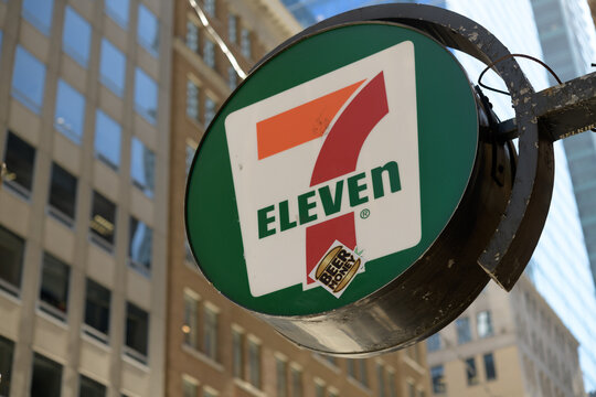 round projecting sign of 7-Eleven, a convenience store chain, located here at 372 Bay St, inside Sterling Tower, Toronto