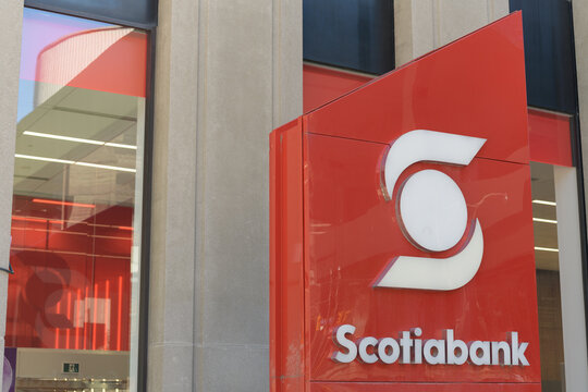 corporate logo sign of Scotiabank, the Bank of Nova Scotia outside a branch located at 392 Bay St, Toronto
