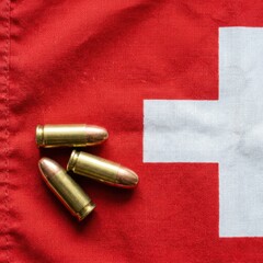 Obraz premium Swiss Flag with Bullets Symbolizing Conflict Security or Military Theme