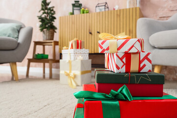 Obraz premium Christmas gift shopping and holiday celebration, stack of wrapped presents with ribbons in a cozy living room interior for seasonal winter festivities