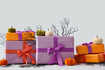 Obraz premium Halloween gift shopping and seasonal celebration, wrapped presents with velvet pumpkins and decorative branches for autumn holiday party decoration