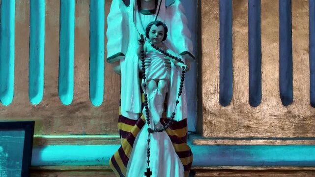 Statue with Child Jesus and rosary, Dumaguete, Philippines