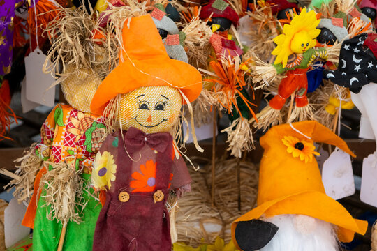 Autumn scarecrow decorations celebrating fall harvest season