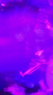 Abstract pink purple blue glowing light motion background