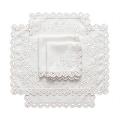 Fototapeta premium Set of Elegant White Embroidered Linen Napkins and Doilies with Handcrafted Crochet Lace Edges and Floral Patterns, Classic Vintage Tableware for Wedding and Home Decor Isolated on White Background