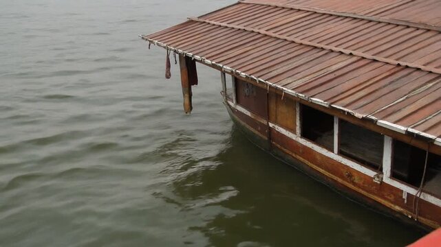 Backwater ripples below a houseboat