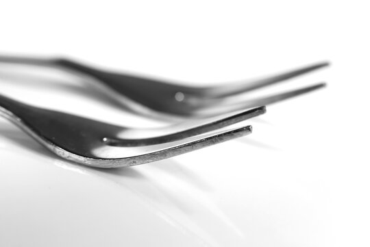 Two metal forks showing kitchenware detail in monochrome