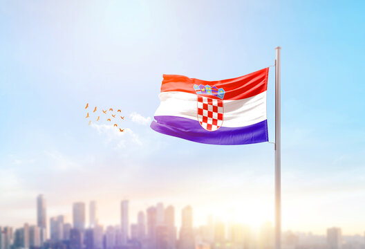 Croatia national flag waving with skyline and buildings.